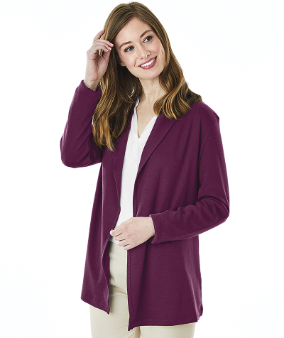 smiling woman wearing plum-purple cardigan