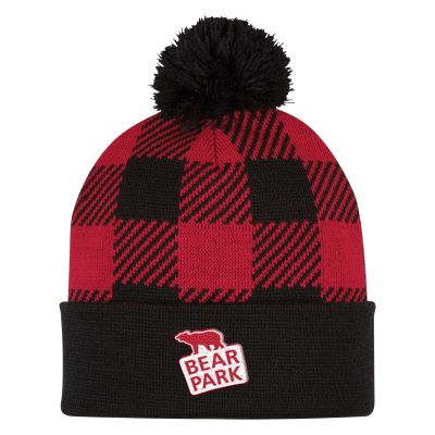 red and black buffalo check knit ski cap with oversized pom