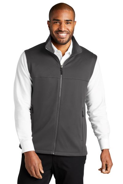 man wearing a gray fleece zip-up vest over a white collared shirt