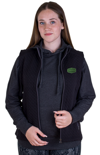 woman wearing black quilted full-zip vest with logo by Vantage