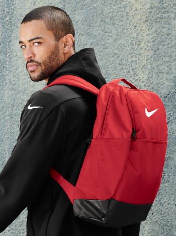 man wearing Nike Brasilia Medium Backpack
