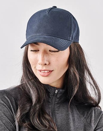 woman wearing Stormtech Explorer baseball cap made from recycled polyester and sustainably sourced cotton