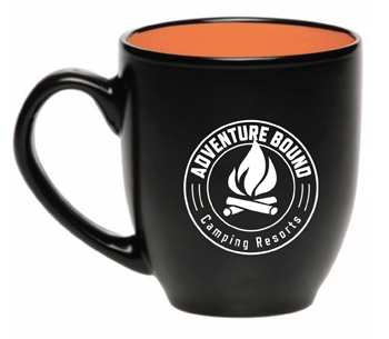 black ceramic coffee mug with orange interior and camping logo