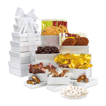 gourmet tower of treats in silver gift boxes