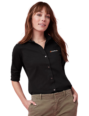 PCNA woman wearing UNTUCKit black Bella Long Sleeve Shirt with sleeves rolled up